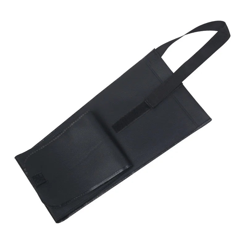 Black apron with a strap on a white background