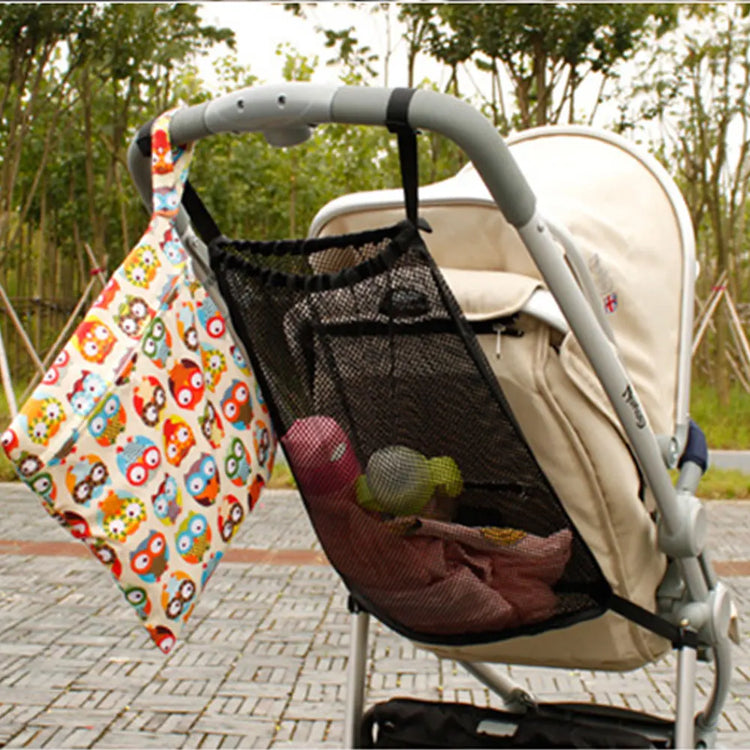 Baby stroller with a hanging organizer and in an outdoor setting.