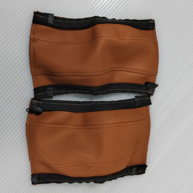 Pair of brown leather stroller handle covers on a white background
