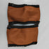 Pair of brown leather stroller handle covers on a white background