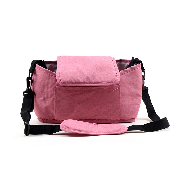 Pink bag with black straps on a white background