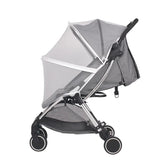Gray stroller with a mesh canopy on a white background