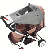 Brown and gray stroller with canopy on a white background