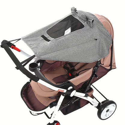 Brown and gray stroller with canopy on a white background