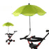 Green umbrella attached to a stroller on a white background