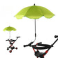 Green umbrella attached to a stroller on a white background