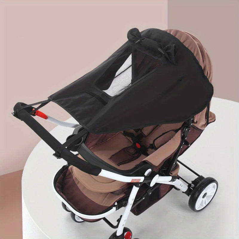 Black and brown baby stroller on a white background