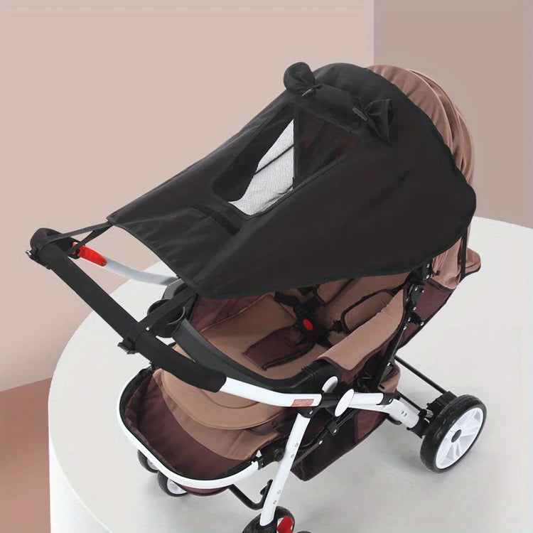 Black and brown baby stroller on a white background