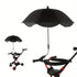 Black umbrella attached to a red and black stroller on a white background