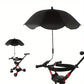 Black umbrella attached to a red and black stroller on a white background