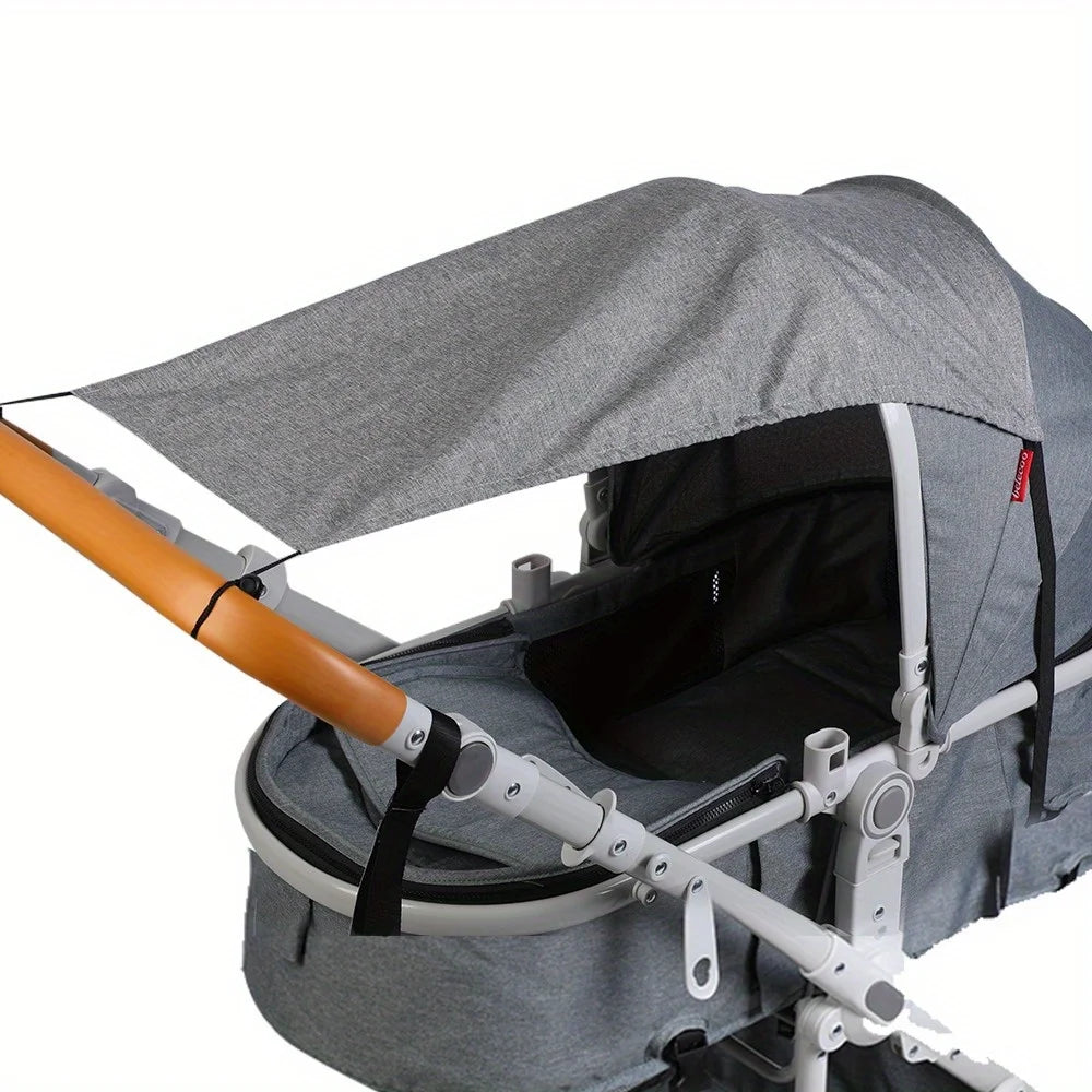Gray stroller with a canopy on a white background