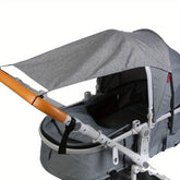 Gray stroller with a canopy on a white background