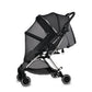 Black stroller with mesh cover on a white background