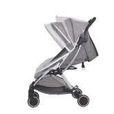 Gray stroller with a transparent canopy on a white background