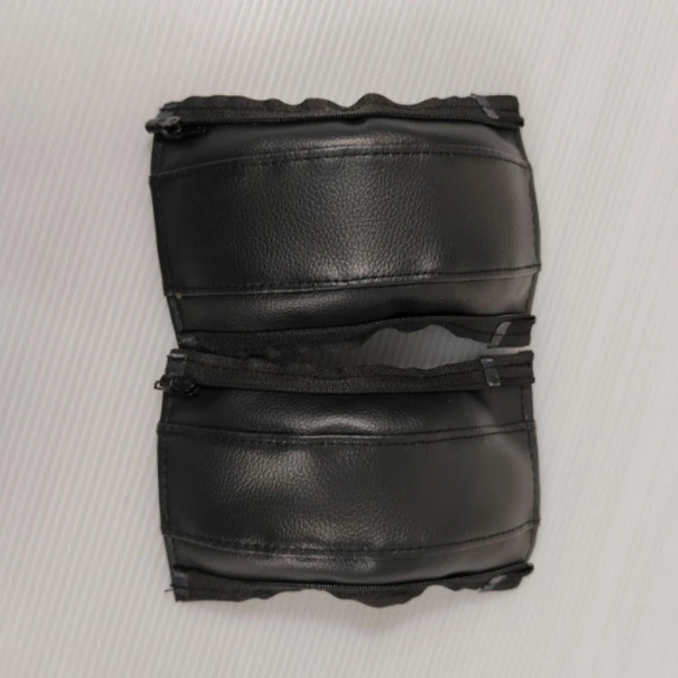 Pair of black leather stroller handle covers on a white background