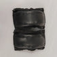 Pair of black leather stroller handle covers on a white background