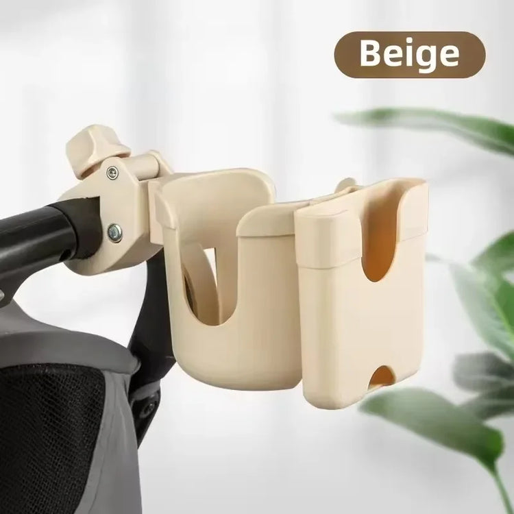 Beige cup holder attached to a stroller with a blurred background