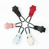 Set of colorful baby clip holders arranged in a circle on a white background