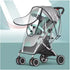 Gray stroller with a transparent rain cover on a light blue background