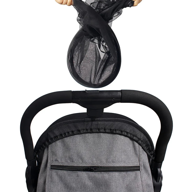 Close-up of a baby car seat with a mesh cover on a white background