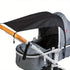 Gray stroller with black canopy on a white background