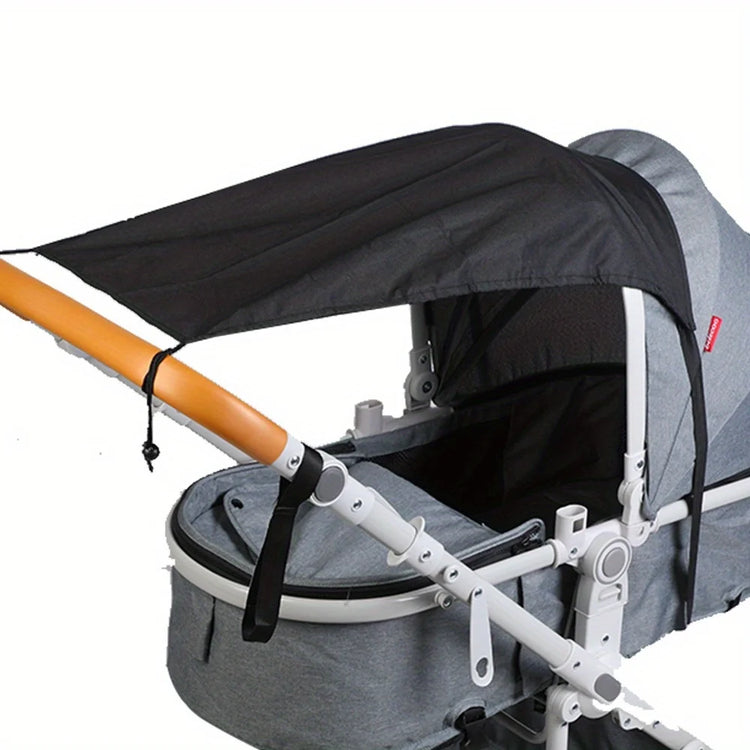 Gray stroller with black canopy on a white background