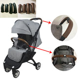 Gray stroller with brown handle covers on a white background
