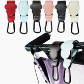 Set of colorful stroller straps with a black carabiner on a white background.