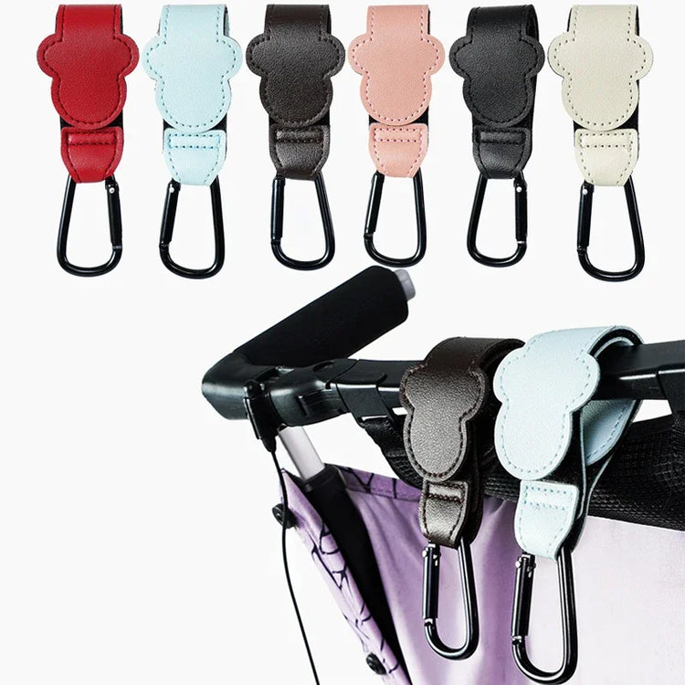 Set of colorful stroller straps with a black carabiner on a white background.