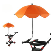 Orange umbrella attached to a stroller on a white background
