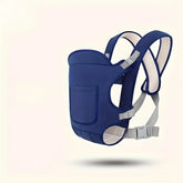 Blue baby carrier with gray straps on a light beige background