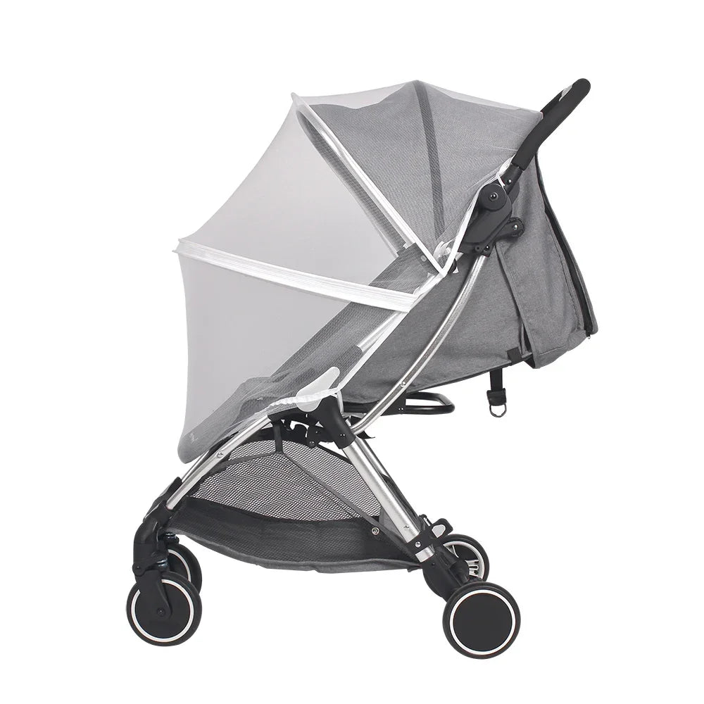 Gray stroller with a mesh canopy on a white background