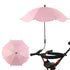 Pink umbrella attached to a stroller on a white background