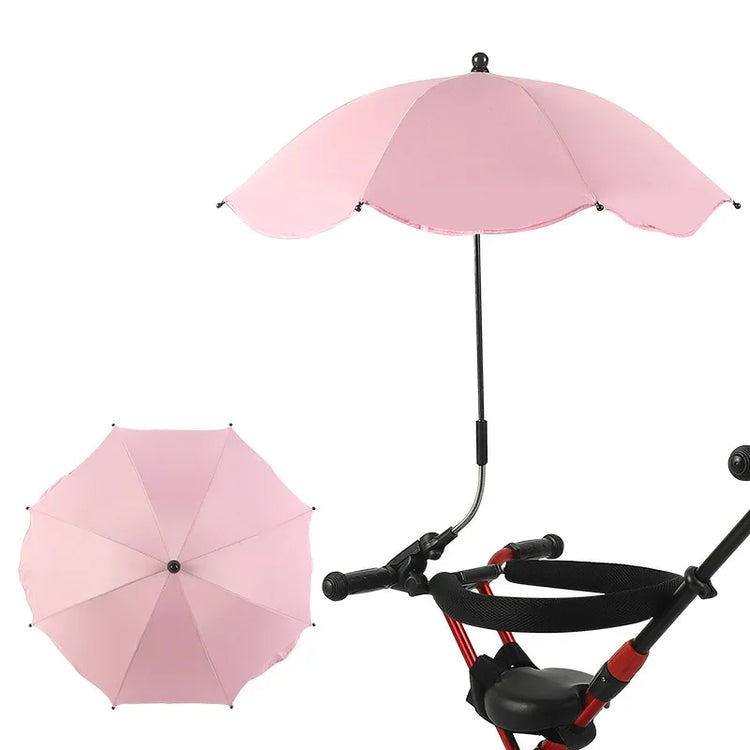 Pink umbrella attached to a stroller on a white background