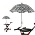 Zebra print umbrella attached to a stroller on a white background