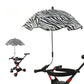 Zebra print umbrella attached to a stroller on a white background